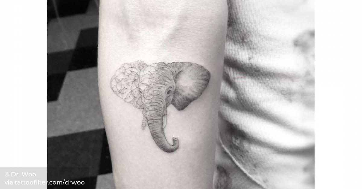 Cara Delevingne fine-line elephant tattoo on her inner forearm