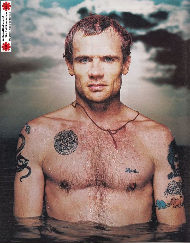 Flea showing a Celtic spiral and elephant tattoo figures
