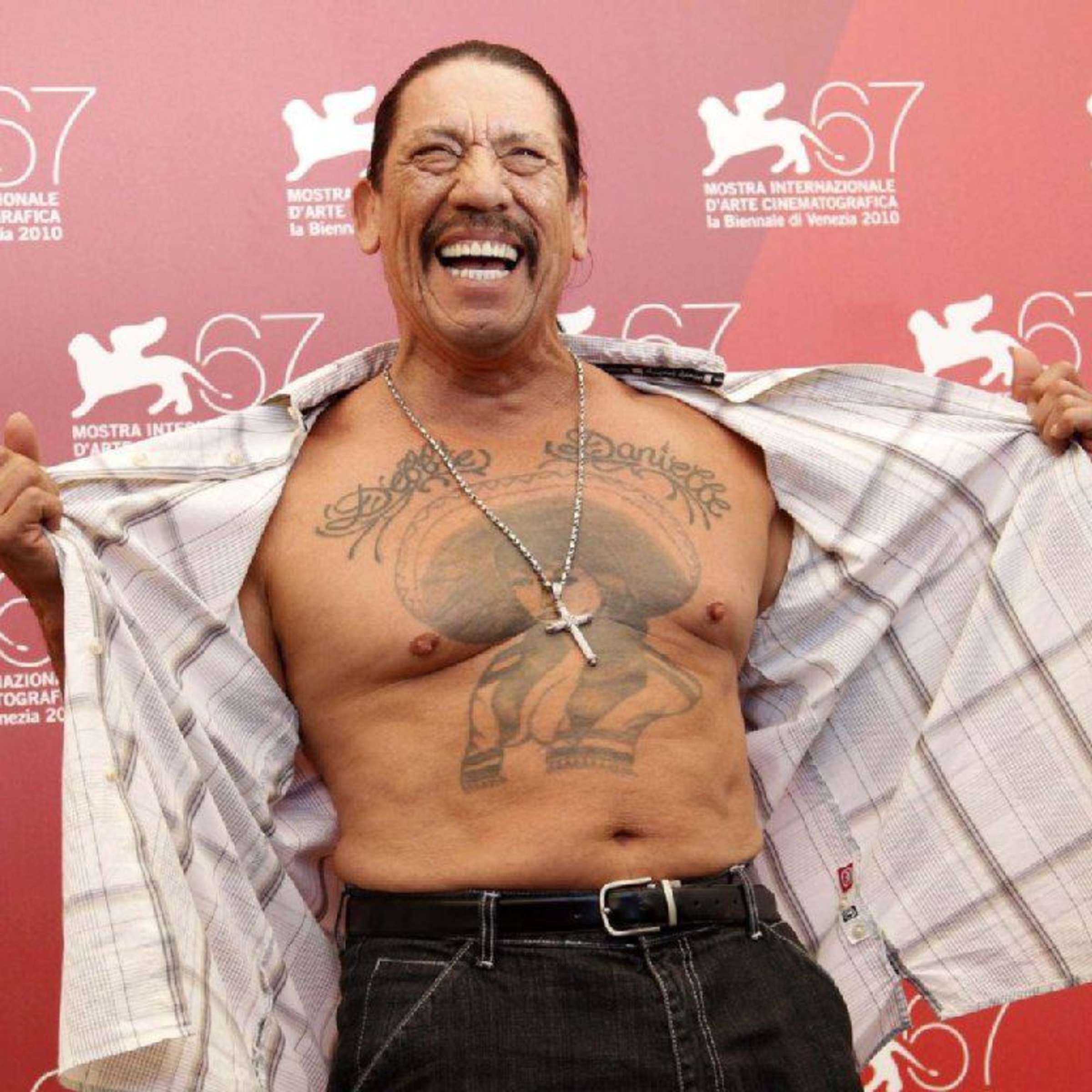 Danny Trejo showing his sombrero woman chest tattoo at Venice