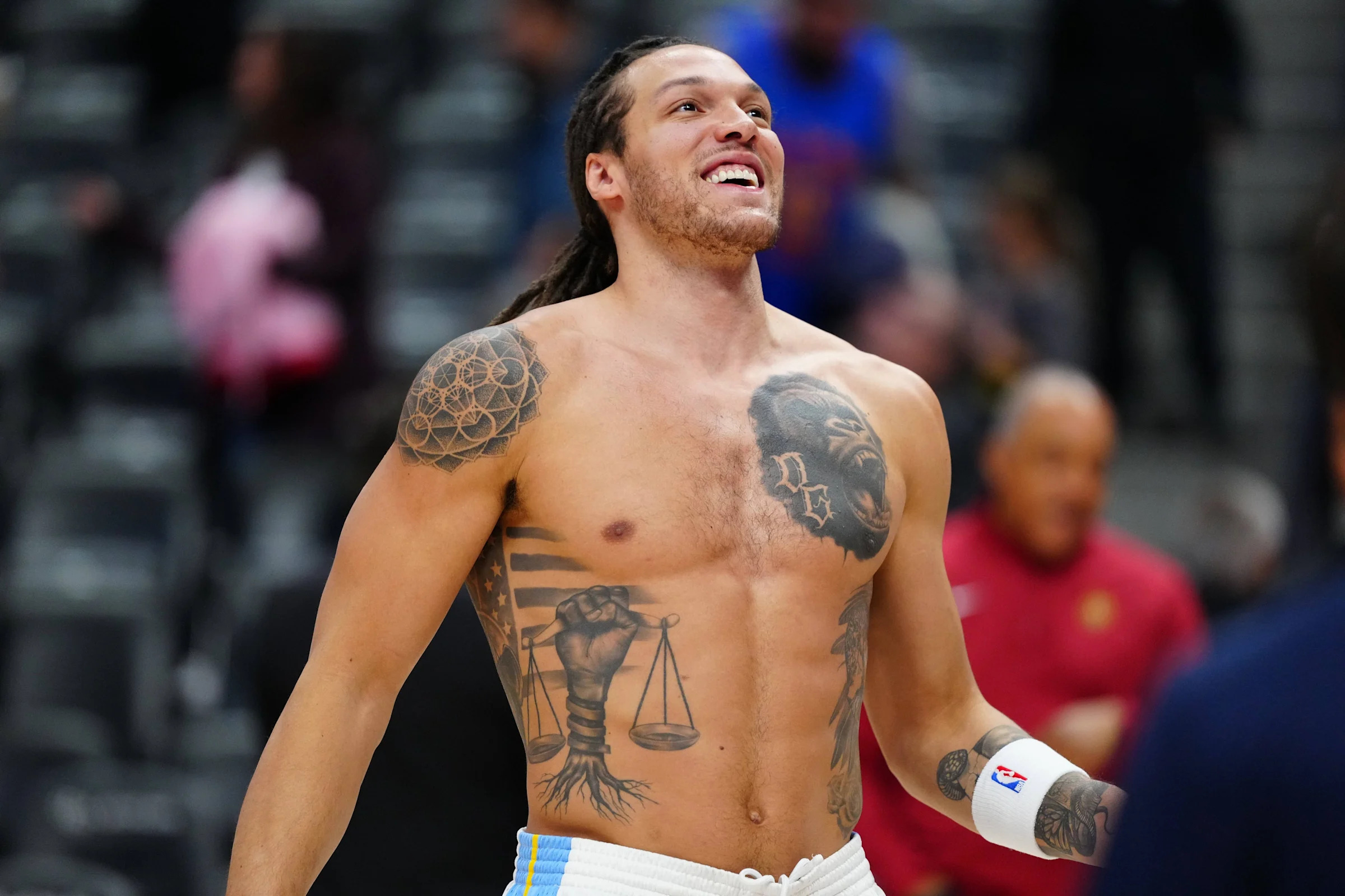 Aaron Gordon black power fist and scales tattoo across his abdomen