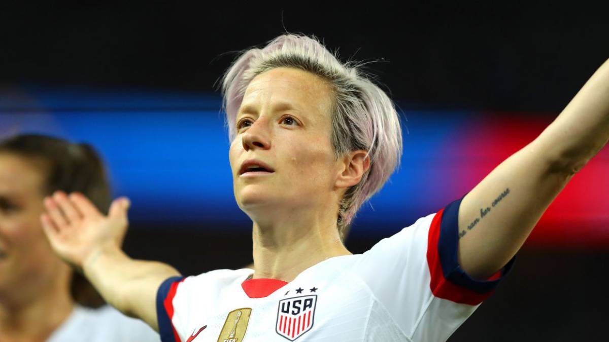 Megan Rapinoe tattoos: distinct large editorial photograph showing tattooed arms and body context