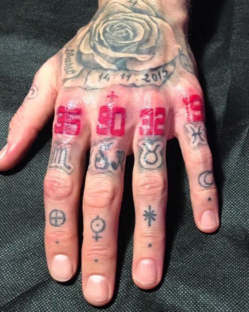 Sergio Ramos red knuckle number tattoos and rose hand tattoo