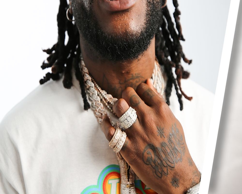 Burna Boy tattoos: Hand and finger tattoo detail from Burna Boy’s GQ Tattoo Tour