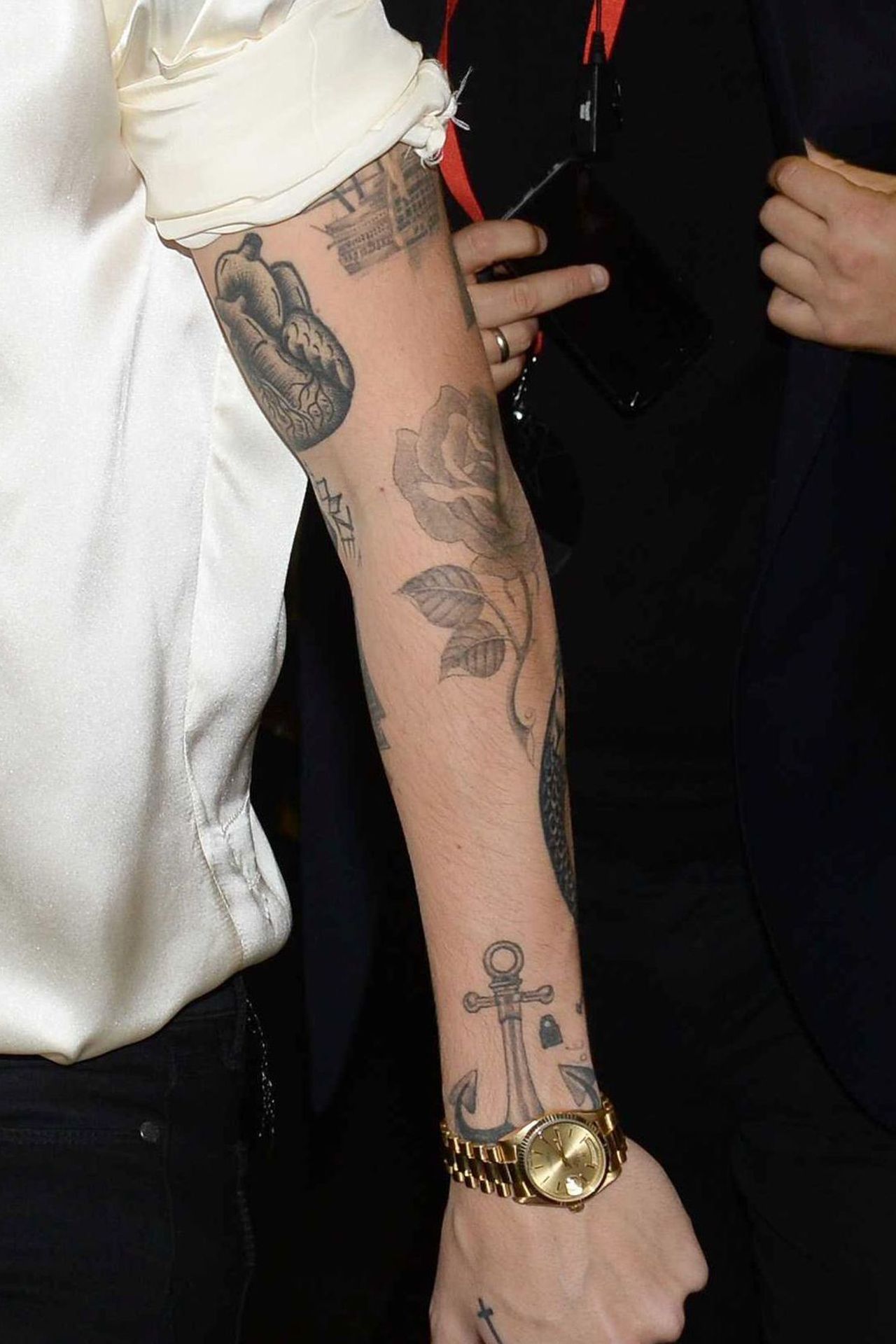 Harry Styles’s left arm tattoos in a close GQ photograph