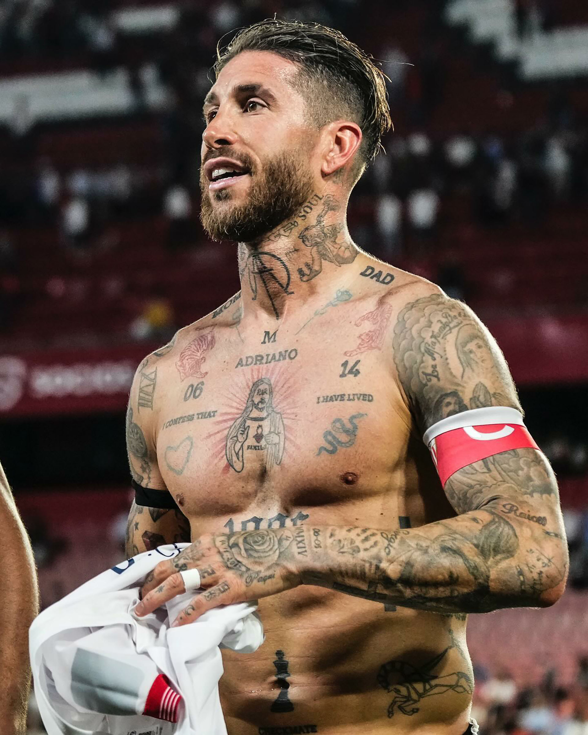 Sergio Ramos chest and neck tattoos after a football match