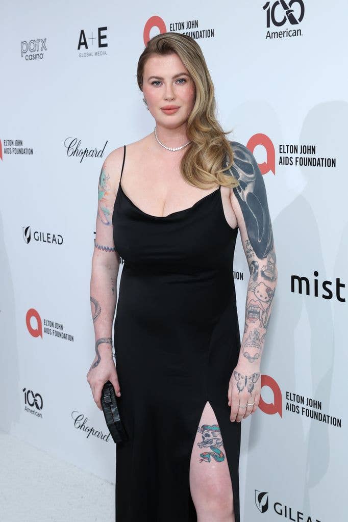 Ireland Baldwin colorful arm tattoos and Ghostface sleeve at red carpet