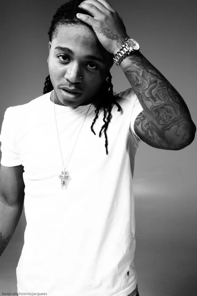 Jacquees with visible neck, hand and arm tattoos