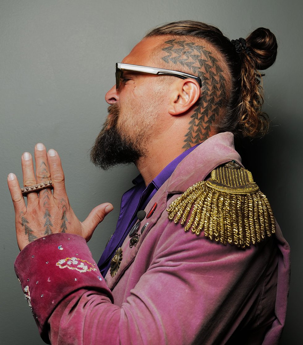 Jason Momoa shark tooth tattoo on the side of his head