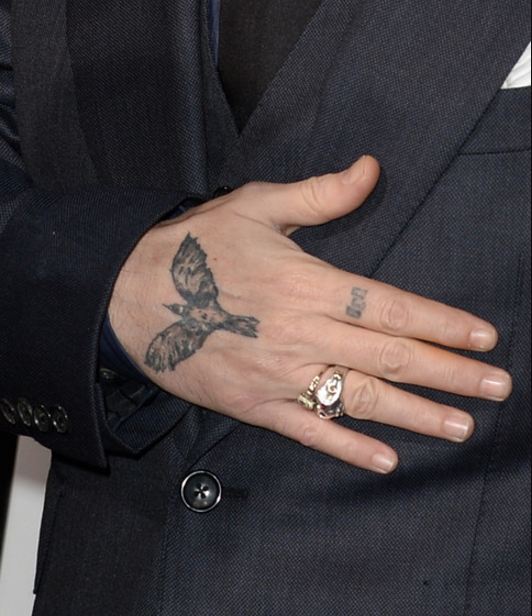 Johnny Depp crow tattoo on the back of his hand