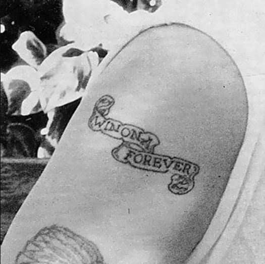 Johnny Depp Wino Forever tattoo on his upper arm