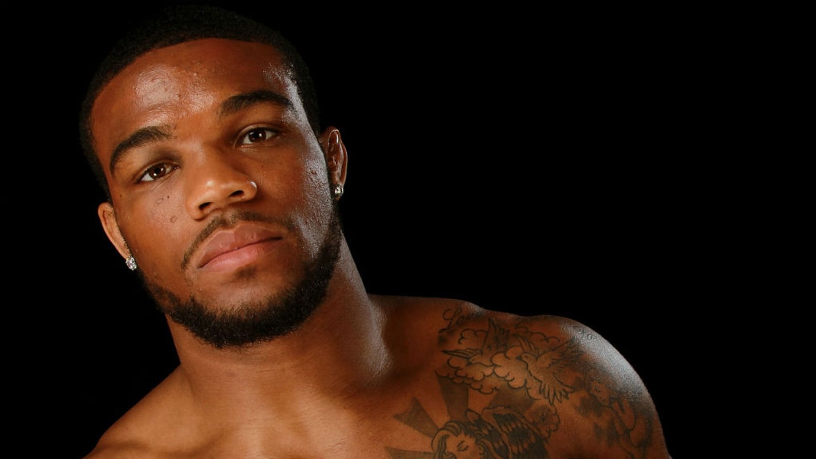 Jordan Burroughs Olympic rings tattoo on left arm