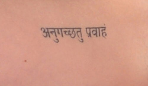 Katy Perry’s Sanskrit go with the flow tattoo on her bicep