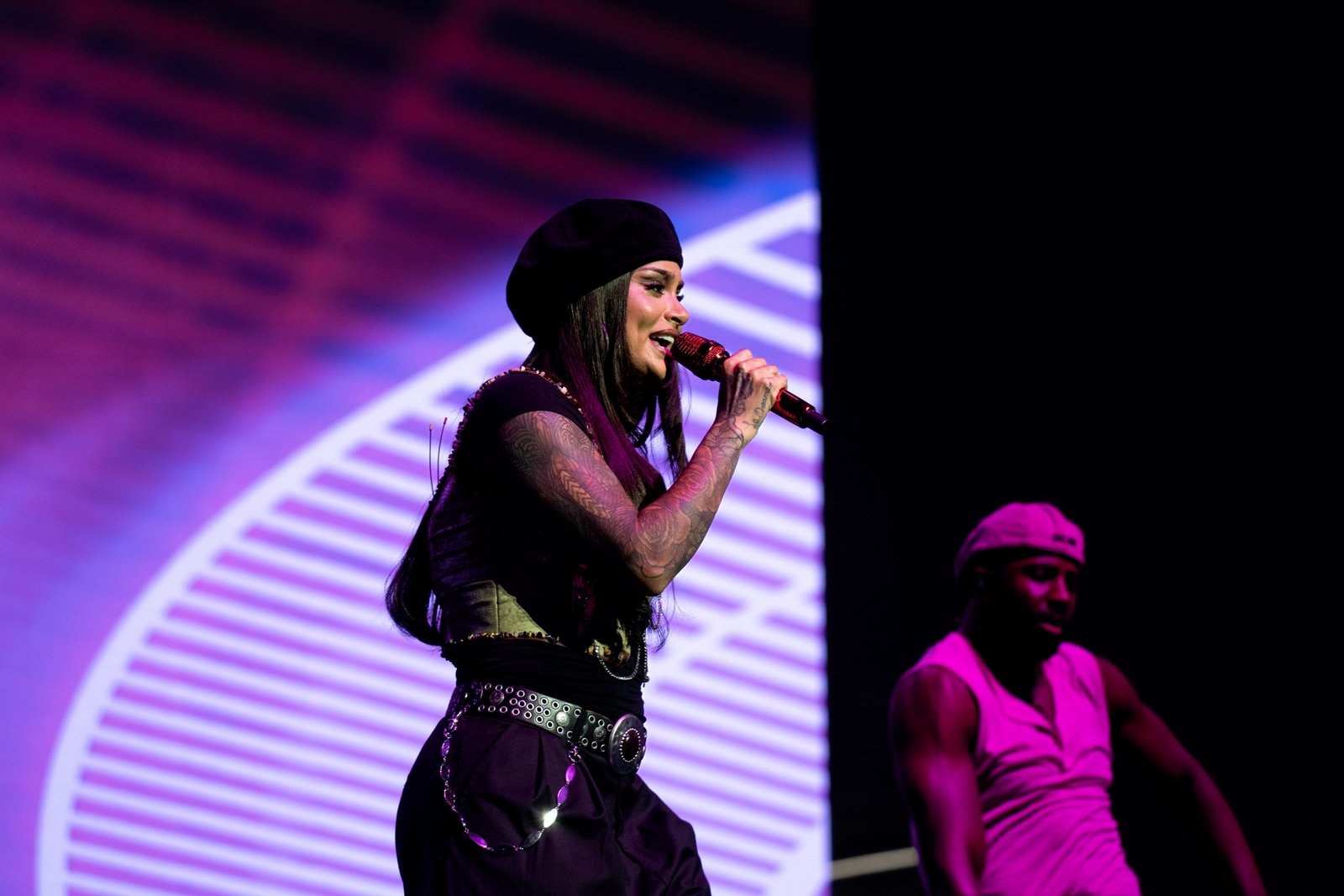 Kehlani showing arm portrait tattoos