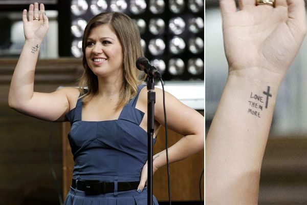 Kelly Clarkson Love Them More stage wrist tattoo