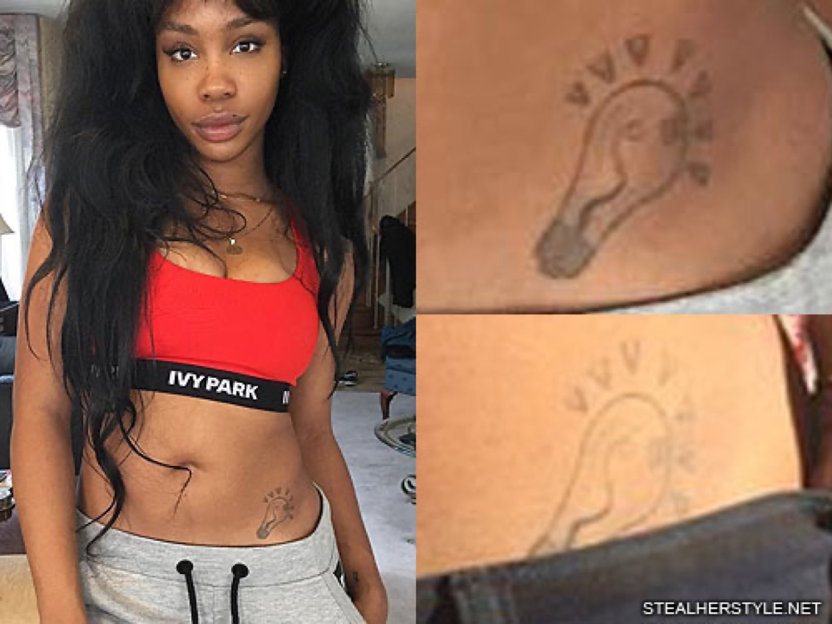 SZA tattoos: clear close-up of SZA’s light bulb hip tattoo