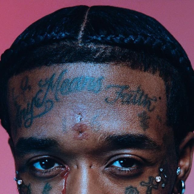 Lil Uzi Vert facial symbol tattoo