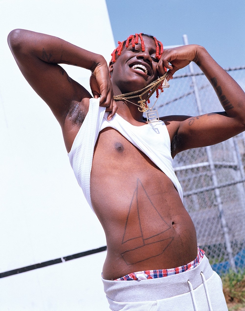 Lil Yachty sailboat abdomen tattoo