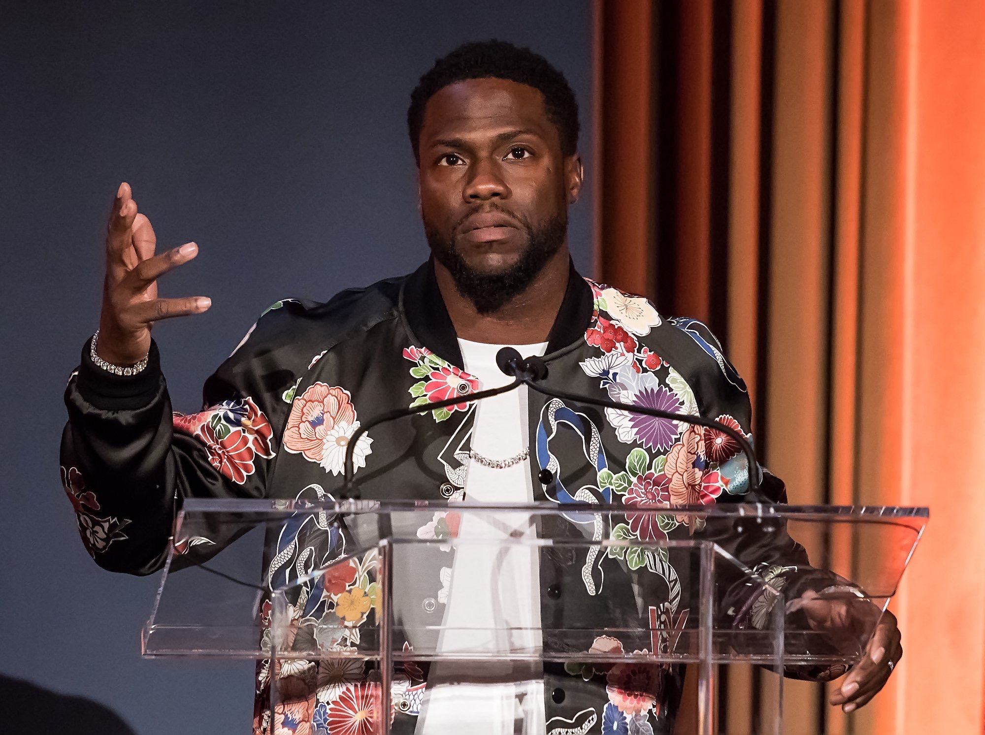 Kevin Hart tattoos: separate high-resolution tattoo-session photograph showing the back and upper-body layout
