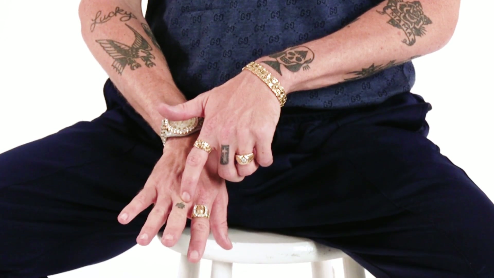 Macklemore finger and hand tattoos shown in the GQ Tattoo Tour