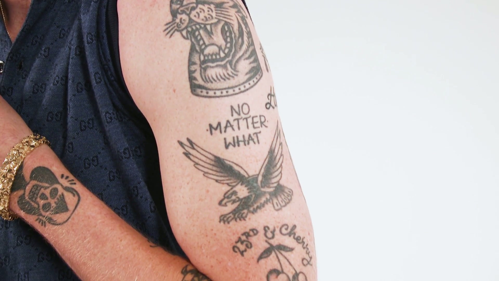 Macklemore 23rd and Cherry forearm tattoo