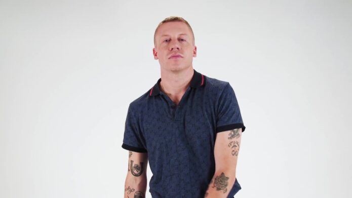Macklemore’s tattooed forearms shown in GQ’s Tattoo Tour portrait