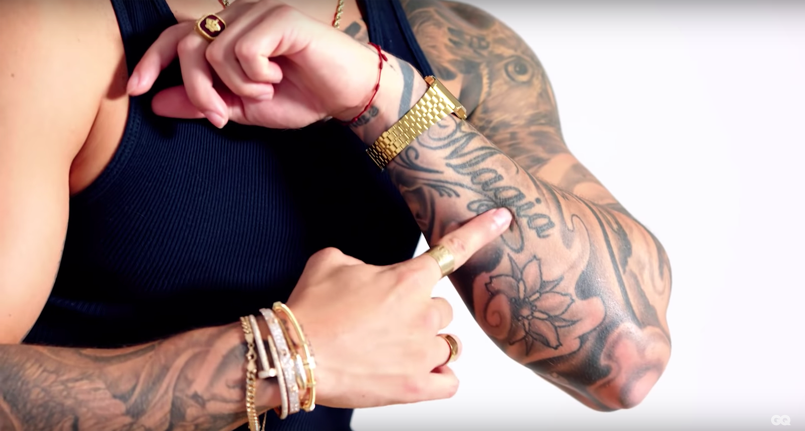 Maluma showing the Magia tattoo on his forearm