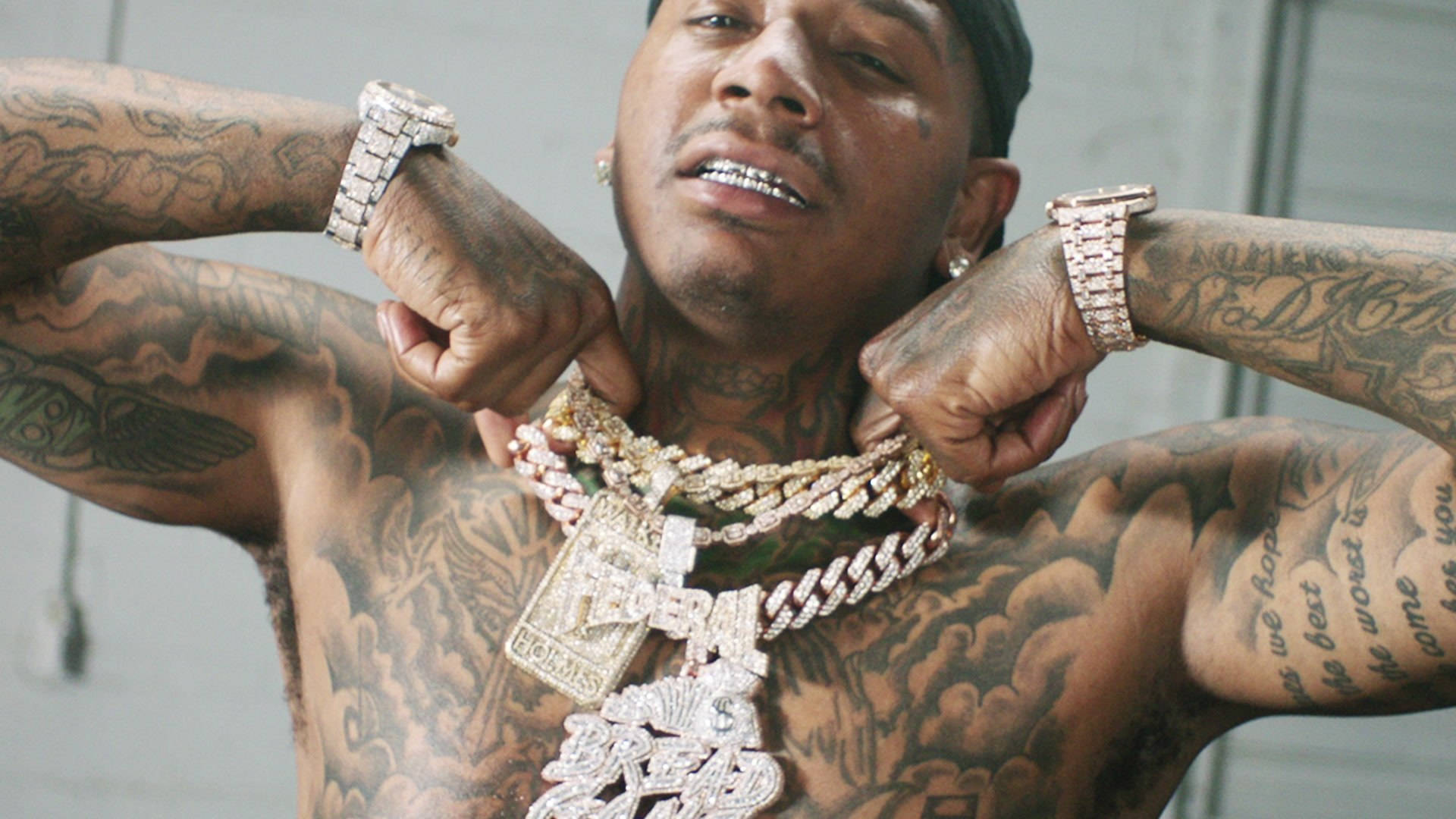 Moneybagg Yo dove and flame tattoos