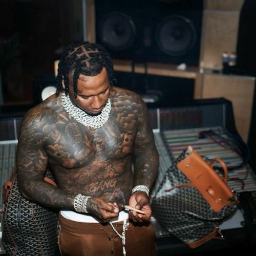 Moneybagg Yo money bag and dollar tattoos