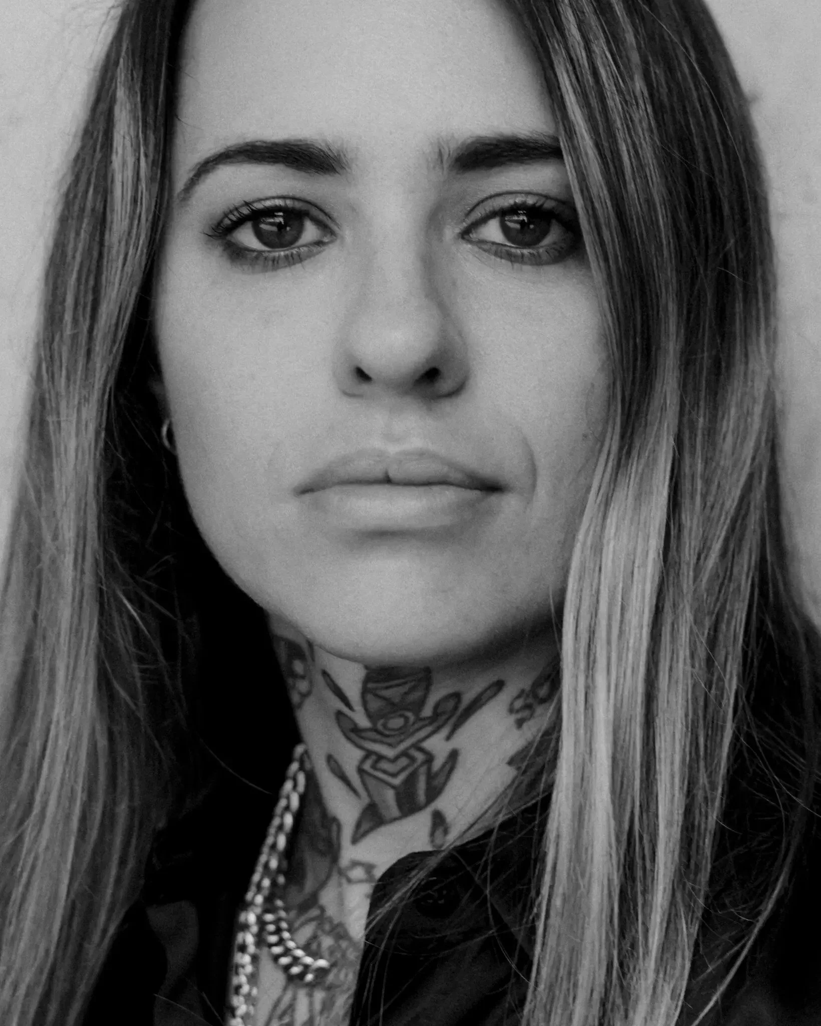 Morgan Wade showing neck tattoos and old-school Sailor Jerry style pieces