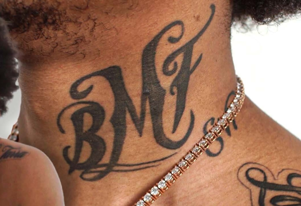 Lil Meech tattoos: Close crop showing the BMF neck tattoo