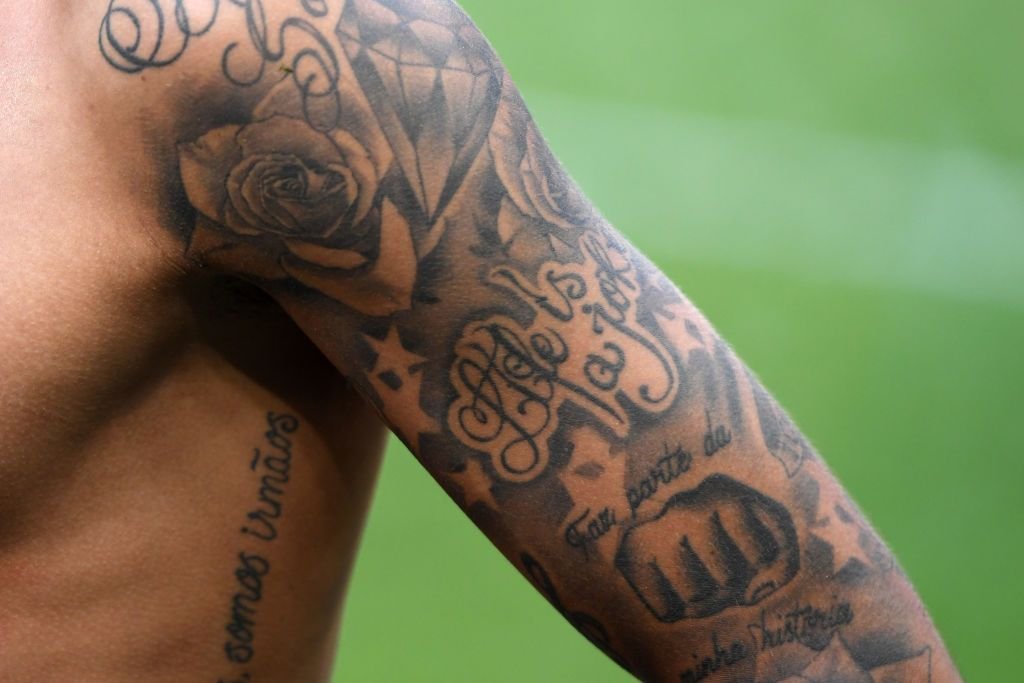 Neymar forearm sleeve tattoos with script and rose