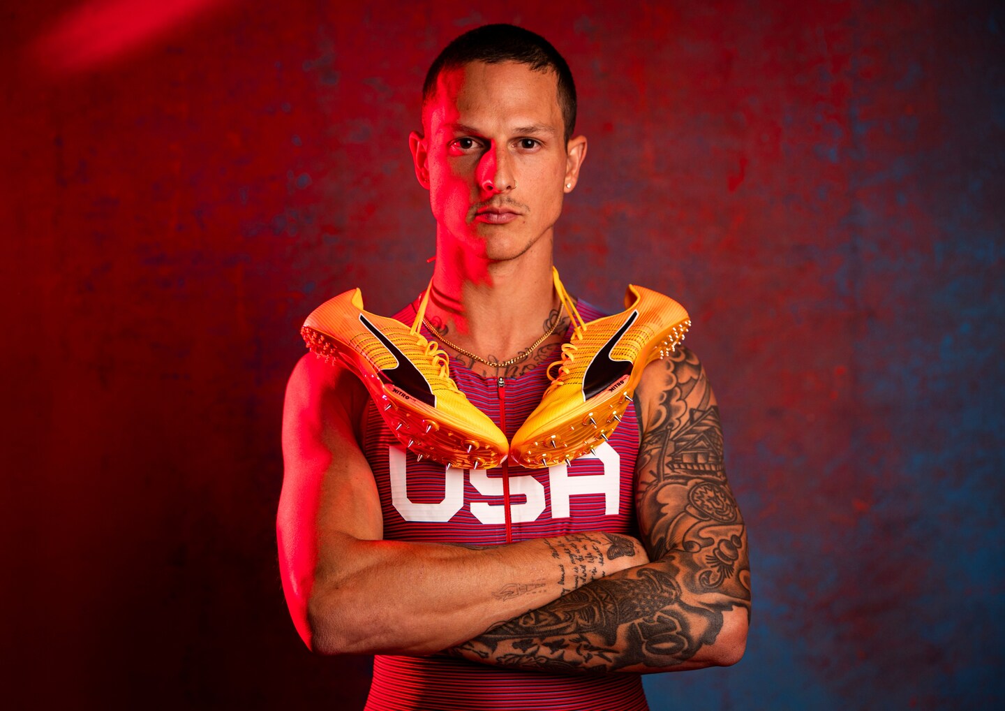 Nick Mayhugh full arm sleeve tattoos in a Team USA portrait