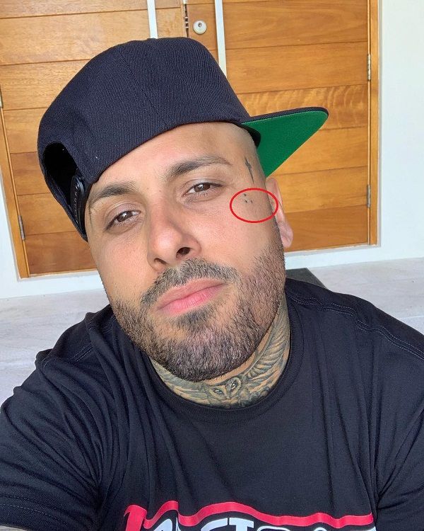 Nicky Jam three dots face tattoo