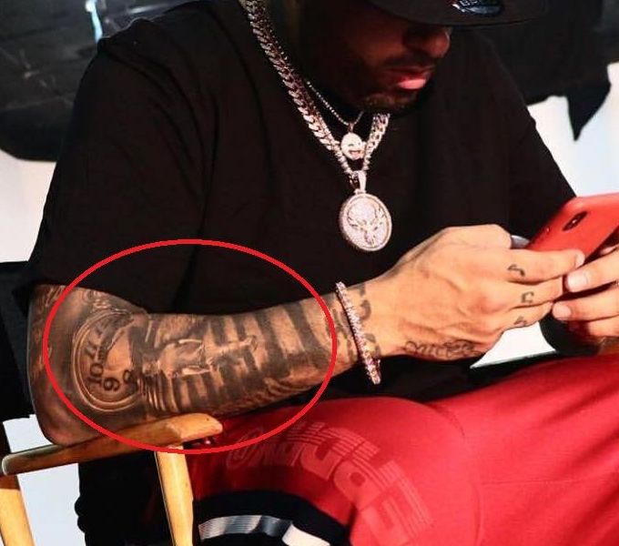 Nicky Jam stairs time machine forearm tattoo