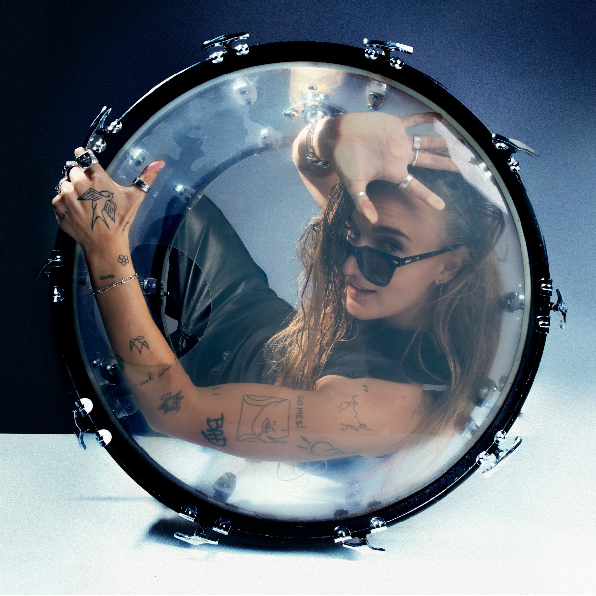 G Flip tattoos: separate drum-shell photograph showing both tattooed arms