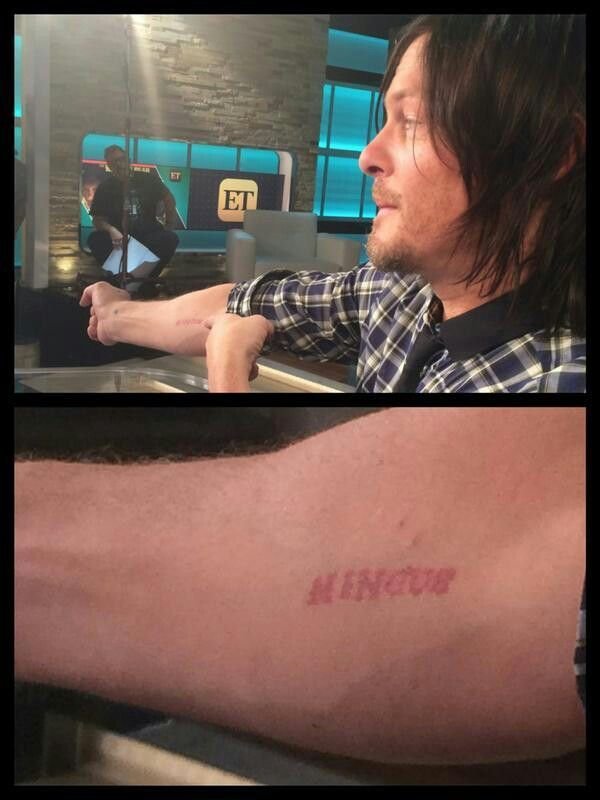 Norman Reedus showing the red Mingus forearm tattoo