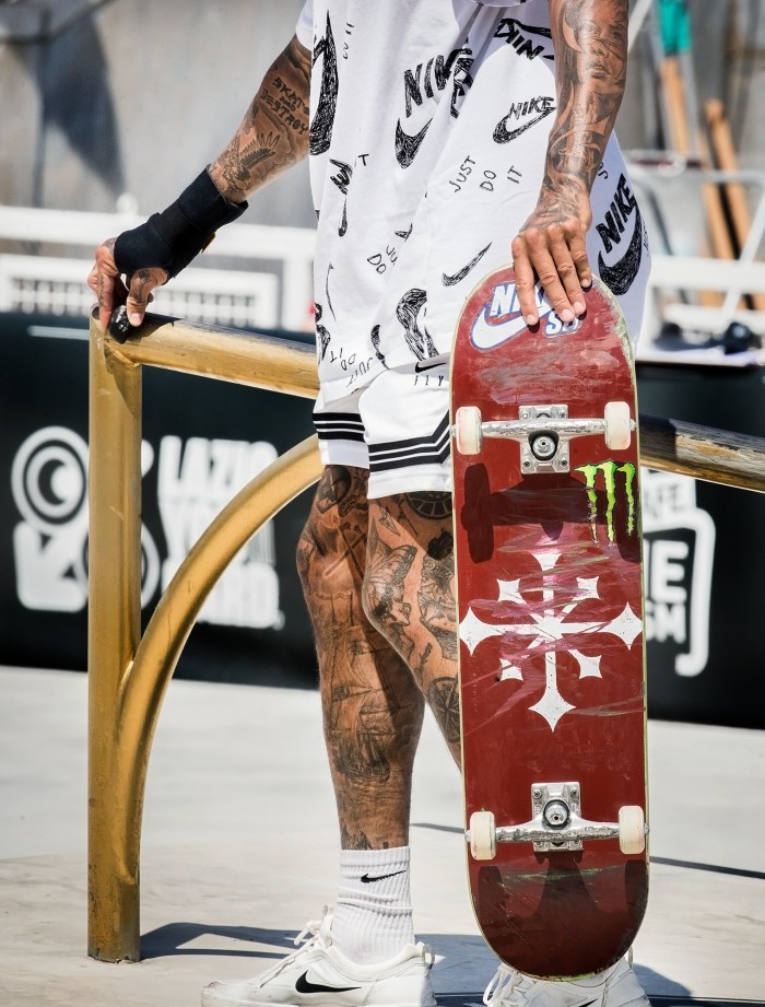 Nyjah Huston leg and arm tattoos at a skate session
