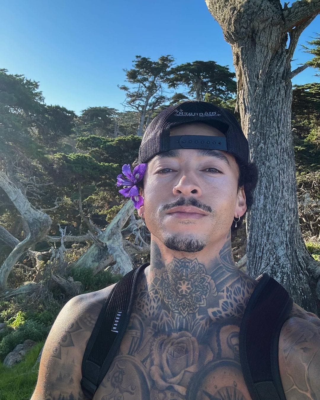 Nyjah Huston selfie showing neck and chest tattoos