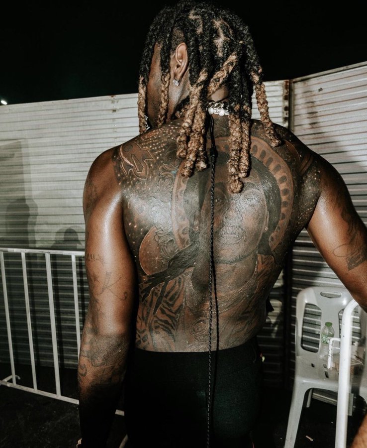 Offset’s Takeoff back portrait tattoo in a separate photograph.