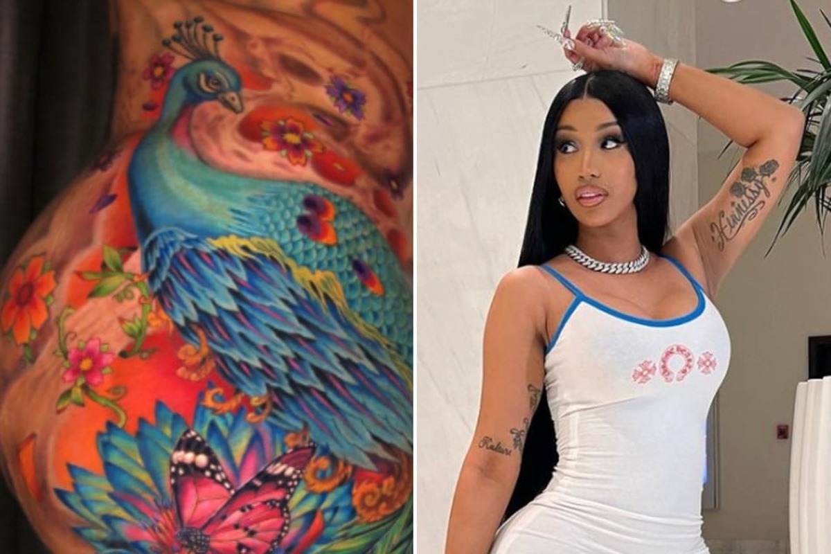 Cardi B tattoos: Cardi B peacock back tattoo with flowers