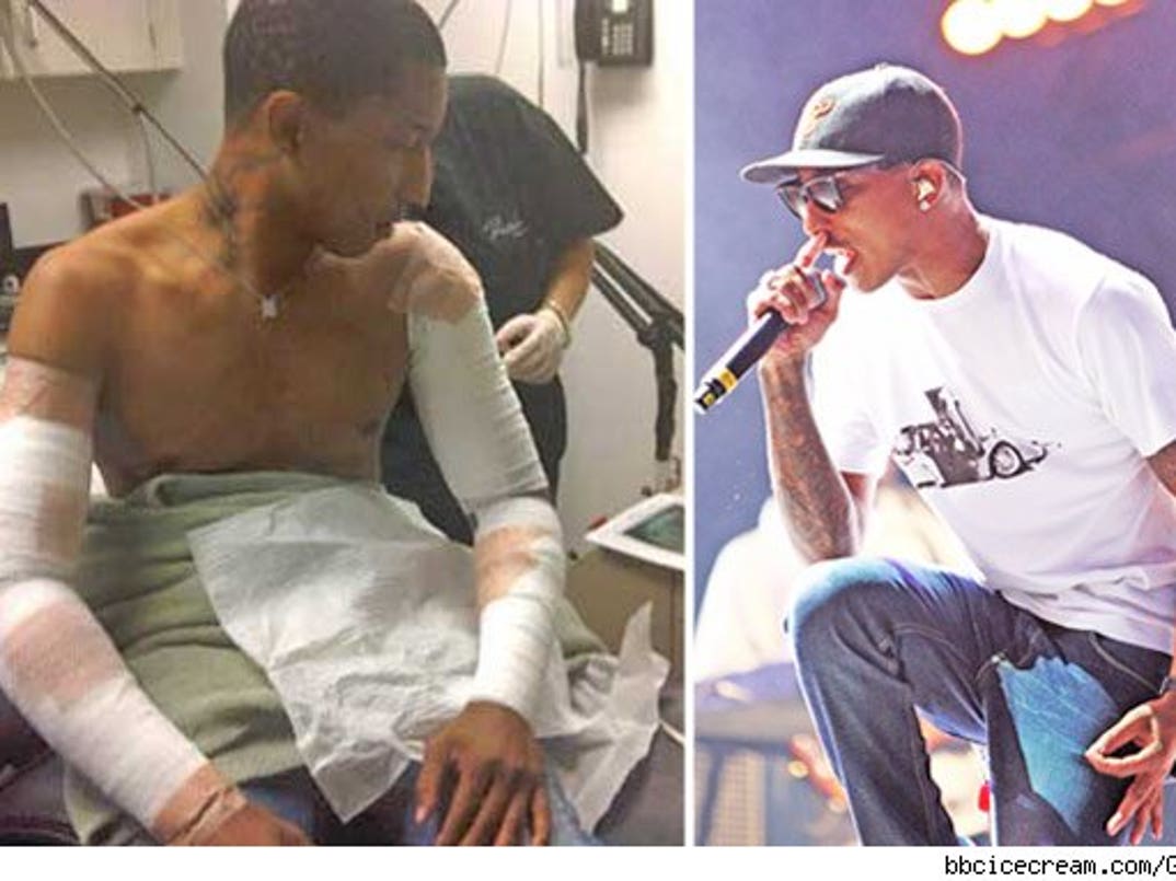 Pharrell Williams undergoing laser tattoo removal on his arms