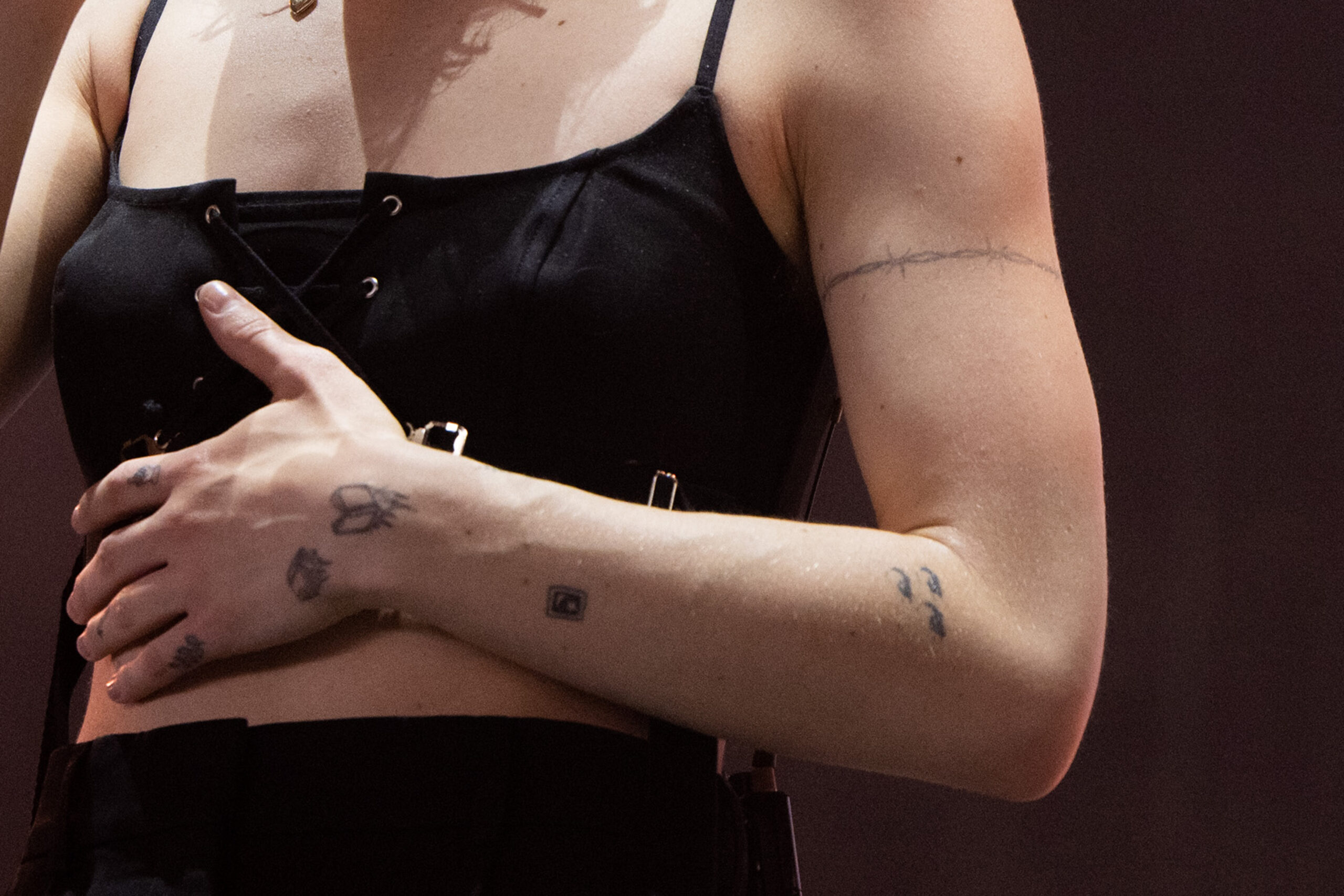 Phoebe Bridgers eyes arm tattoo