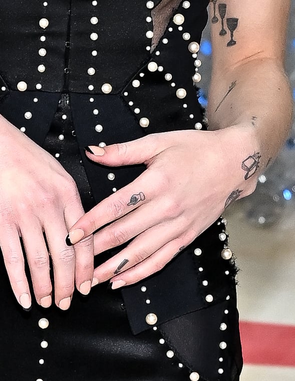 Phoebe Bridgers hand and finger tattoos