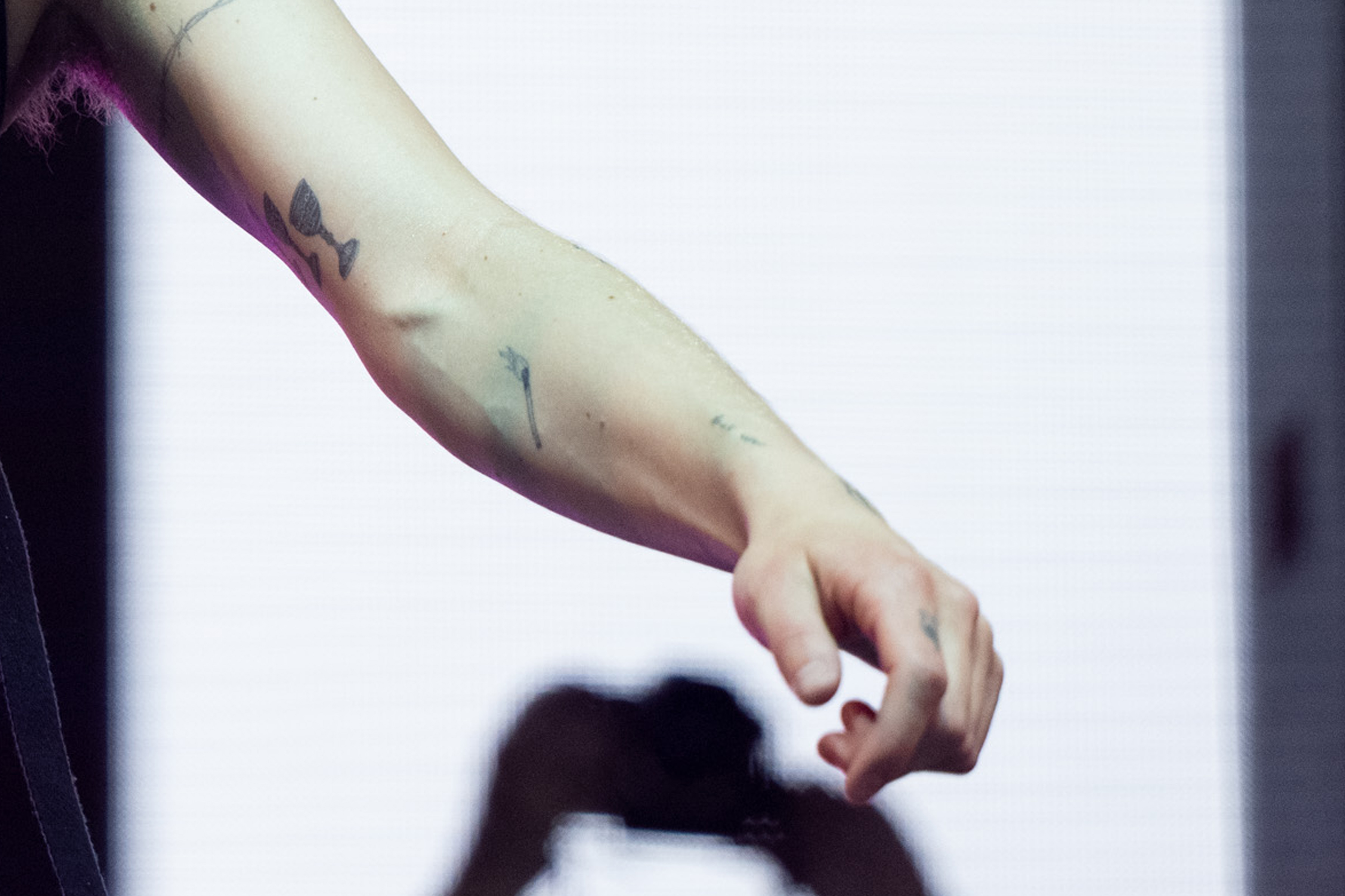 Phoebe Bridgers forearm and hand tattoos