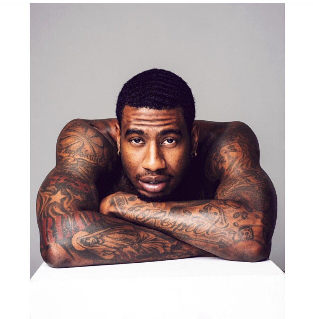 Iman Shumpert tattoos: different shirtless portrait showing the opposite arm and torso coverage