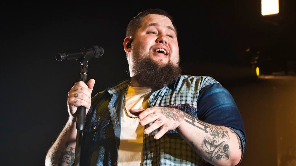 Rag’n’Bone Man forearm words bomb and portrait tattoos