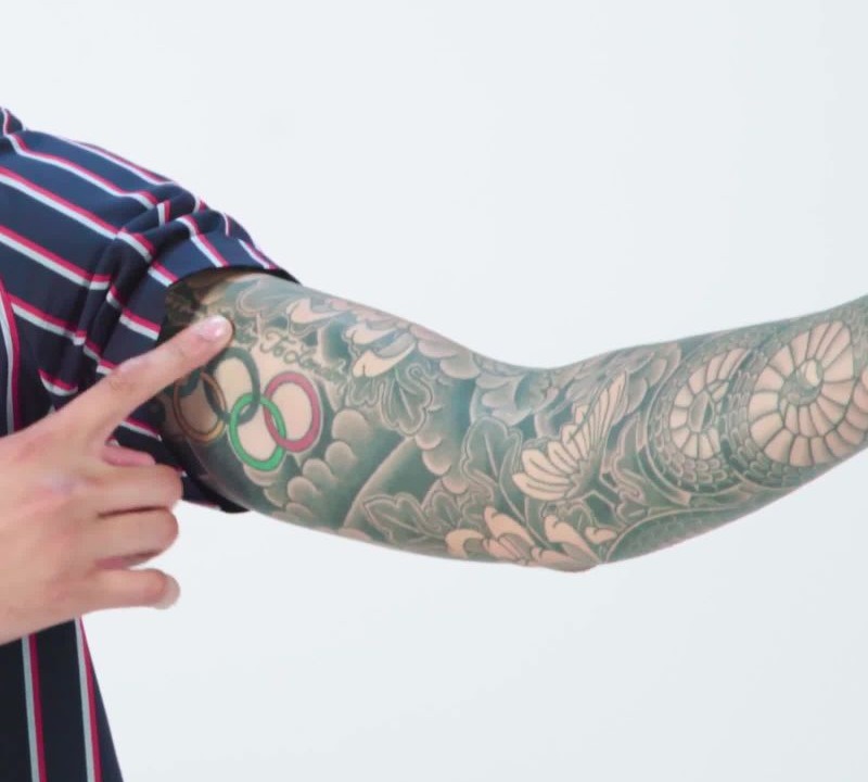 Miles Chamley-Watson tattoos: close detail of his sleeve and forearm tattoos