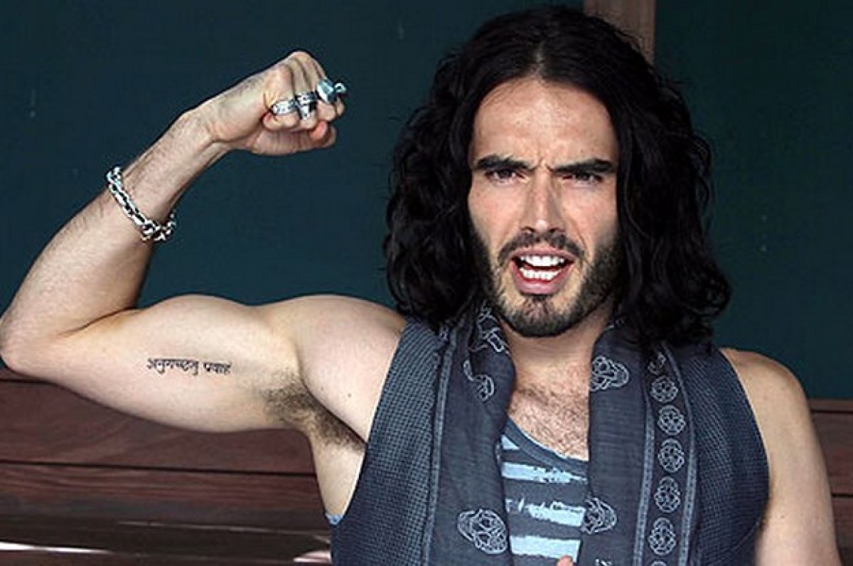 Russell Brand Sanskrit go with the flow tattoo