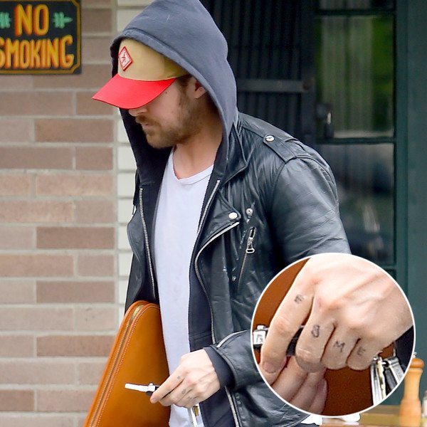 Ryan Gosling showing Esme lettering across his fingers