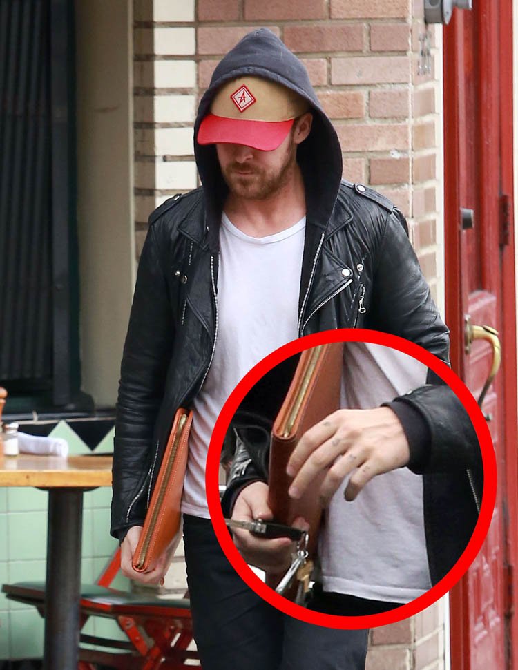 Ryan Gosling showing Esme lettering across his fingers